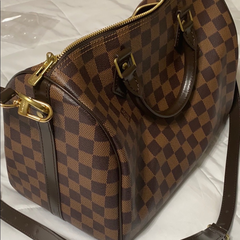 Brown checkered Boston/barrel crossbody bag